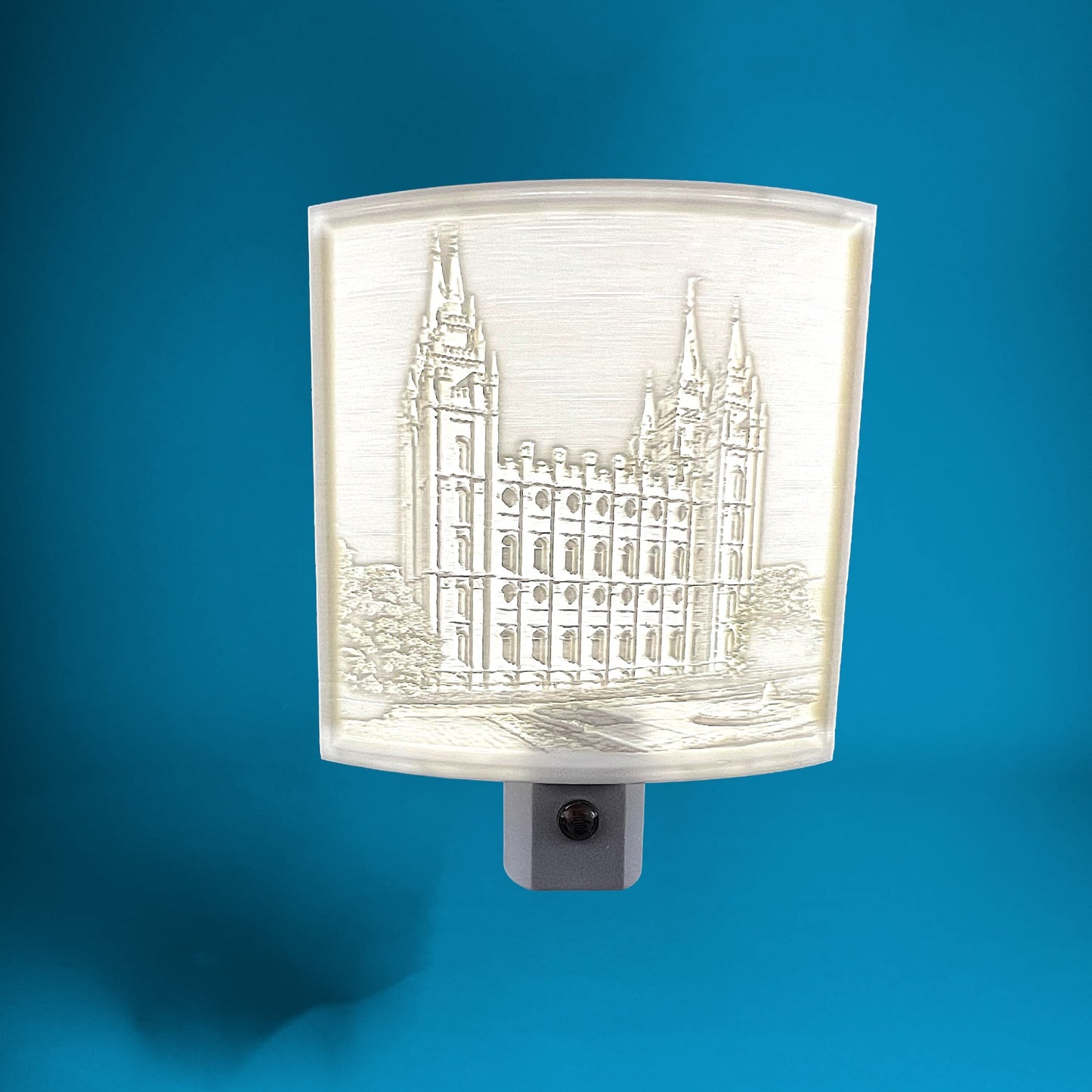 Decorative night light with architectural design on a blue background